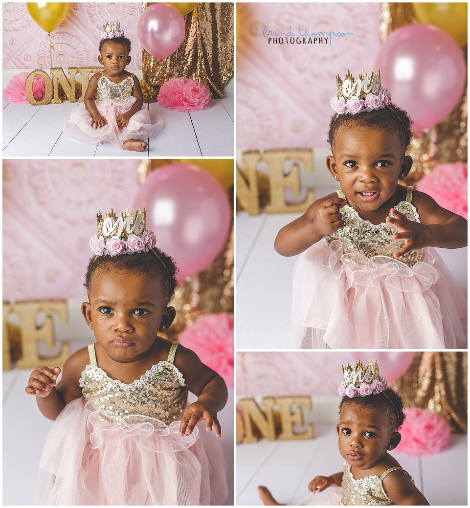 pink and gold first birthday cake smash session in studio with baby girl