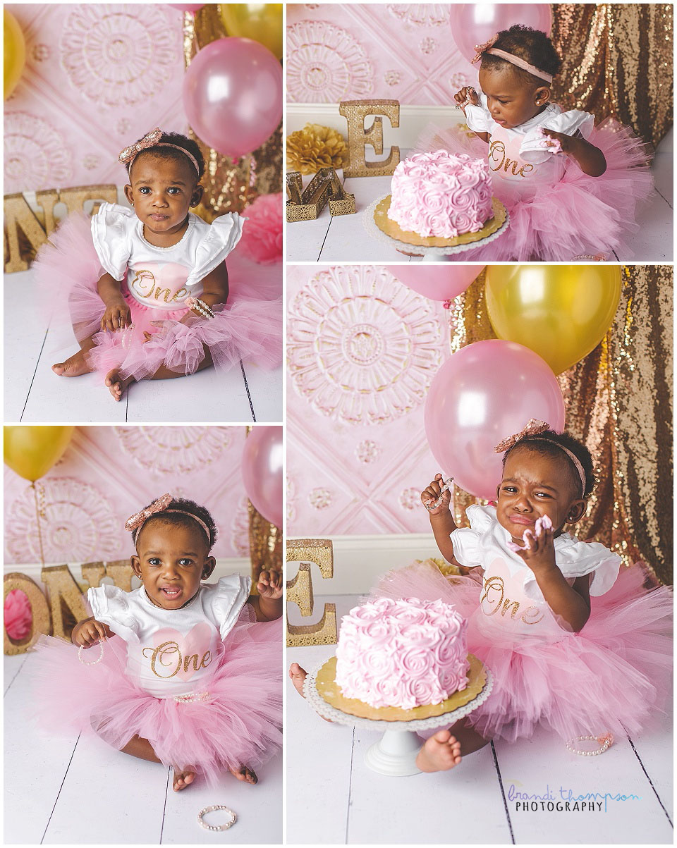 pink and gold first birthday cake smash session in studio with baby girl