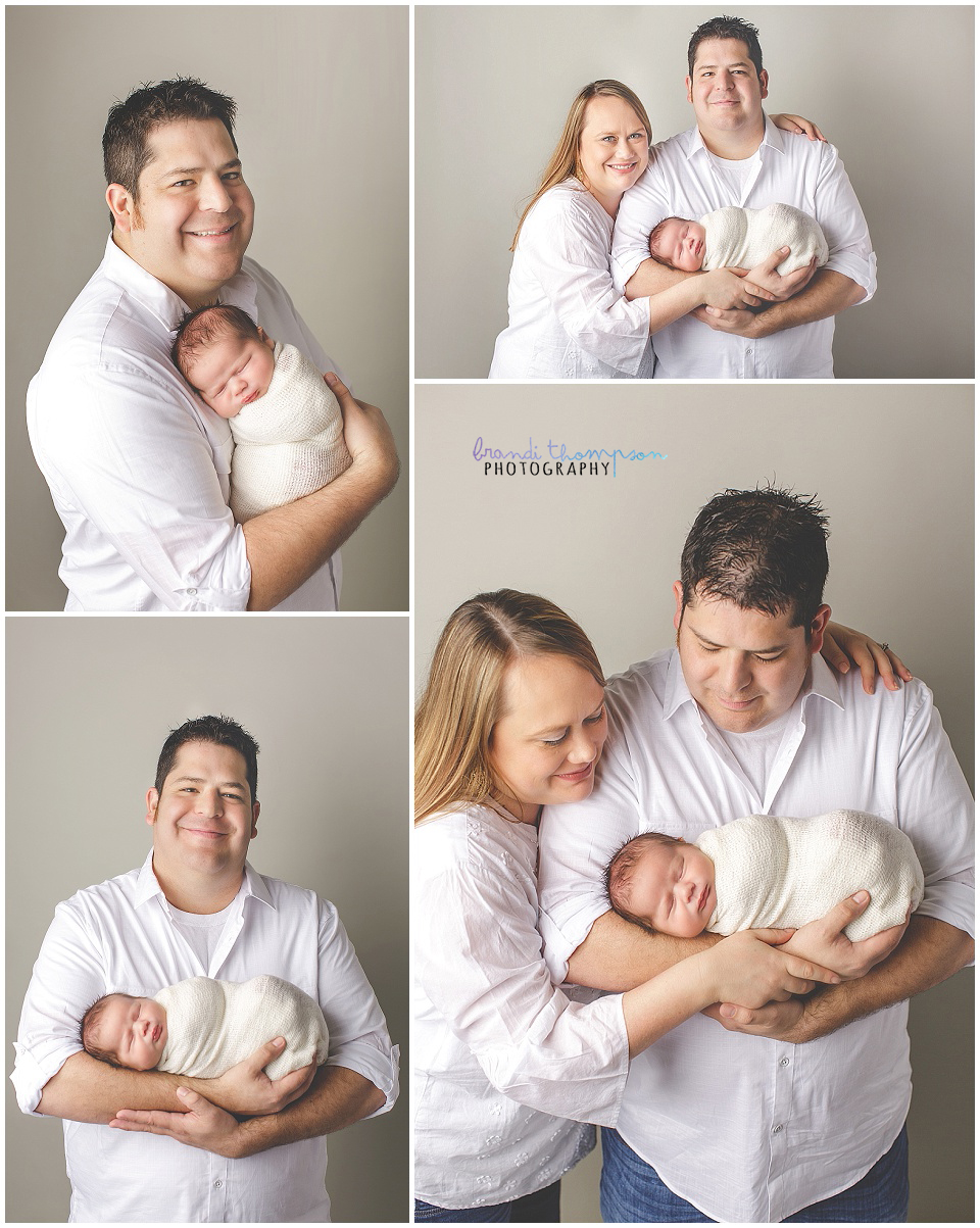 parent photos against a gray backdrop with a newborn baby boy in a plano, tx photography studio