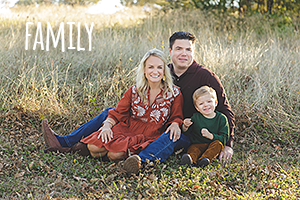 a white family with mom, dad and young son sitting in tall grass and the text reads family