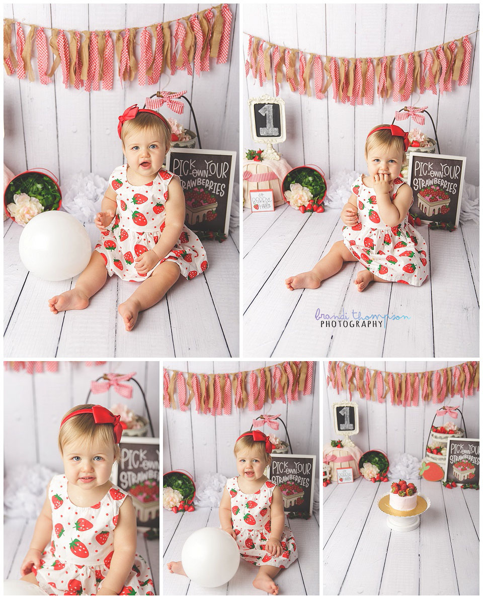 first birthday cake smash for blond one year old girl in red and white gingham and strawberry theme