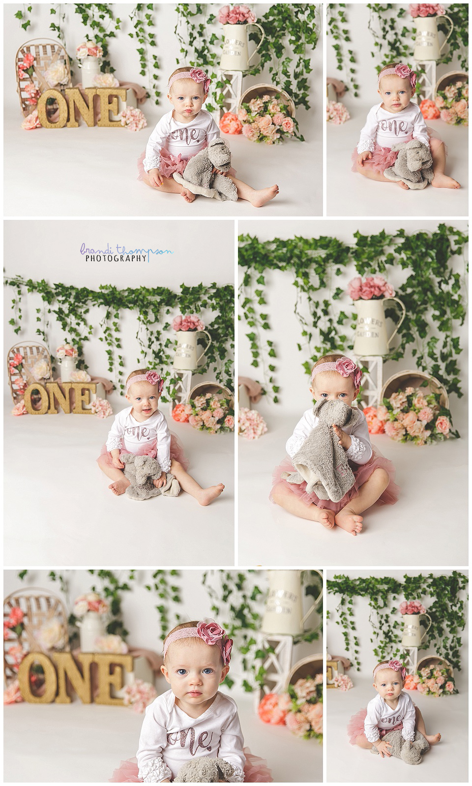 studio cake smash with white baby girl in pink and white with a floral and greenery background and the letters ONE