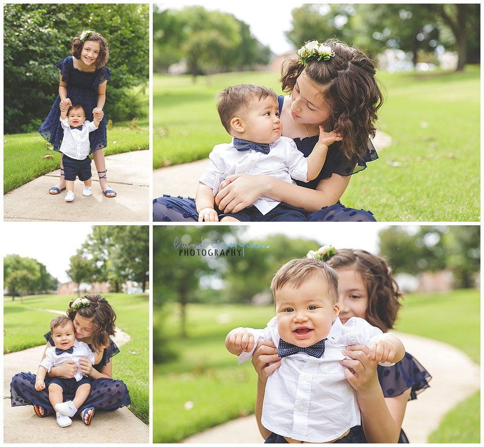 light skinned dark haired one year old boy birthday session in studio with white and blue decor and outdoors with his 9 yr old sister in a blue dress
